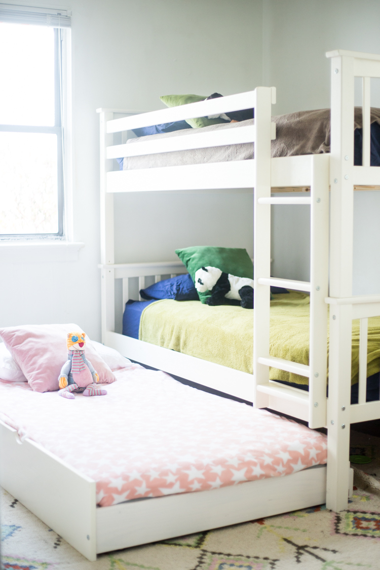 three bunk beds in one room