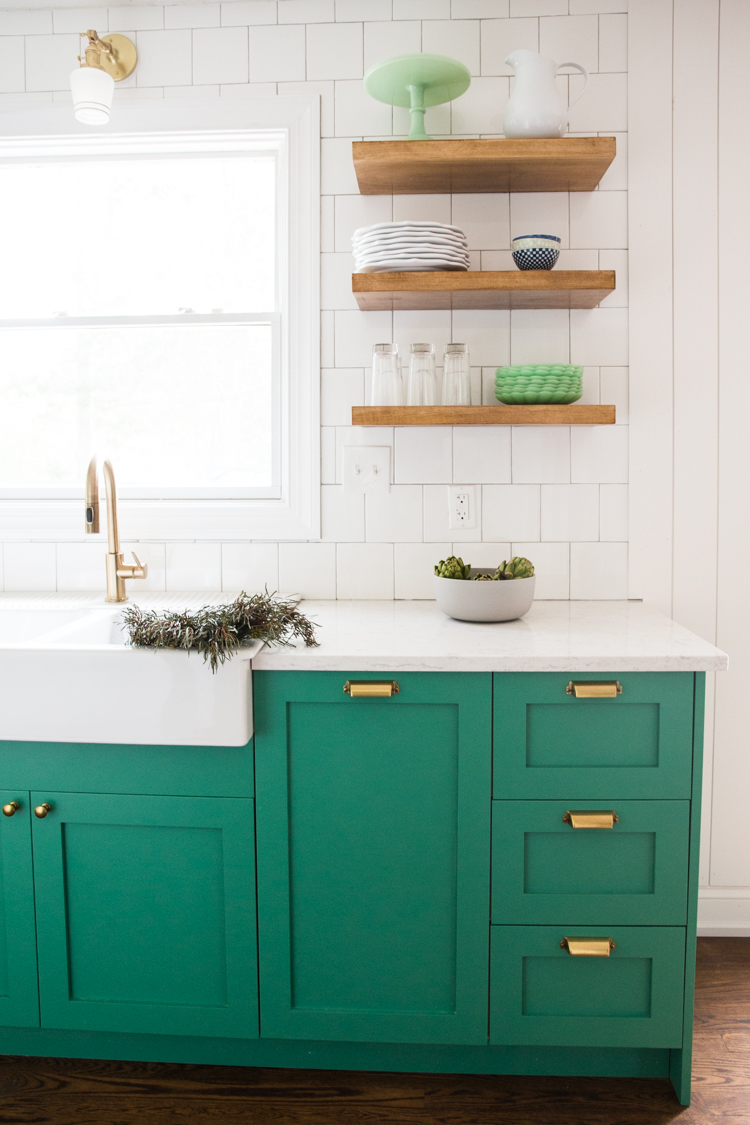 Bold, Small Kitchen with Green Cabinets and Slate Appliances